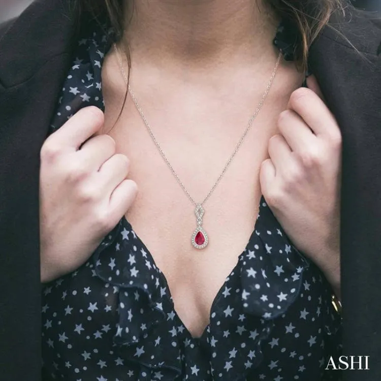 1/6 Ctw Pear Shape 6x4mm Ruby & Round Cut Diamond Precious Pendant With Chain in 10K White Gold