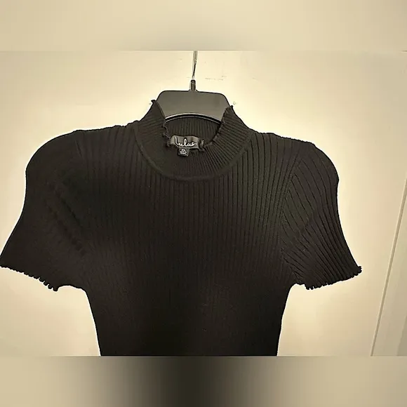 LBD little black dress with short sleeves, high neck, and ribbed bodycon