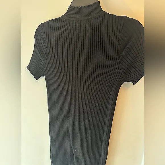 LBD little black dress with short sleeves, high neck, and ribbed bodycon