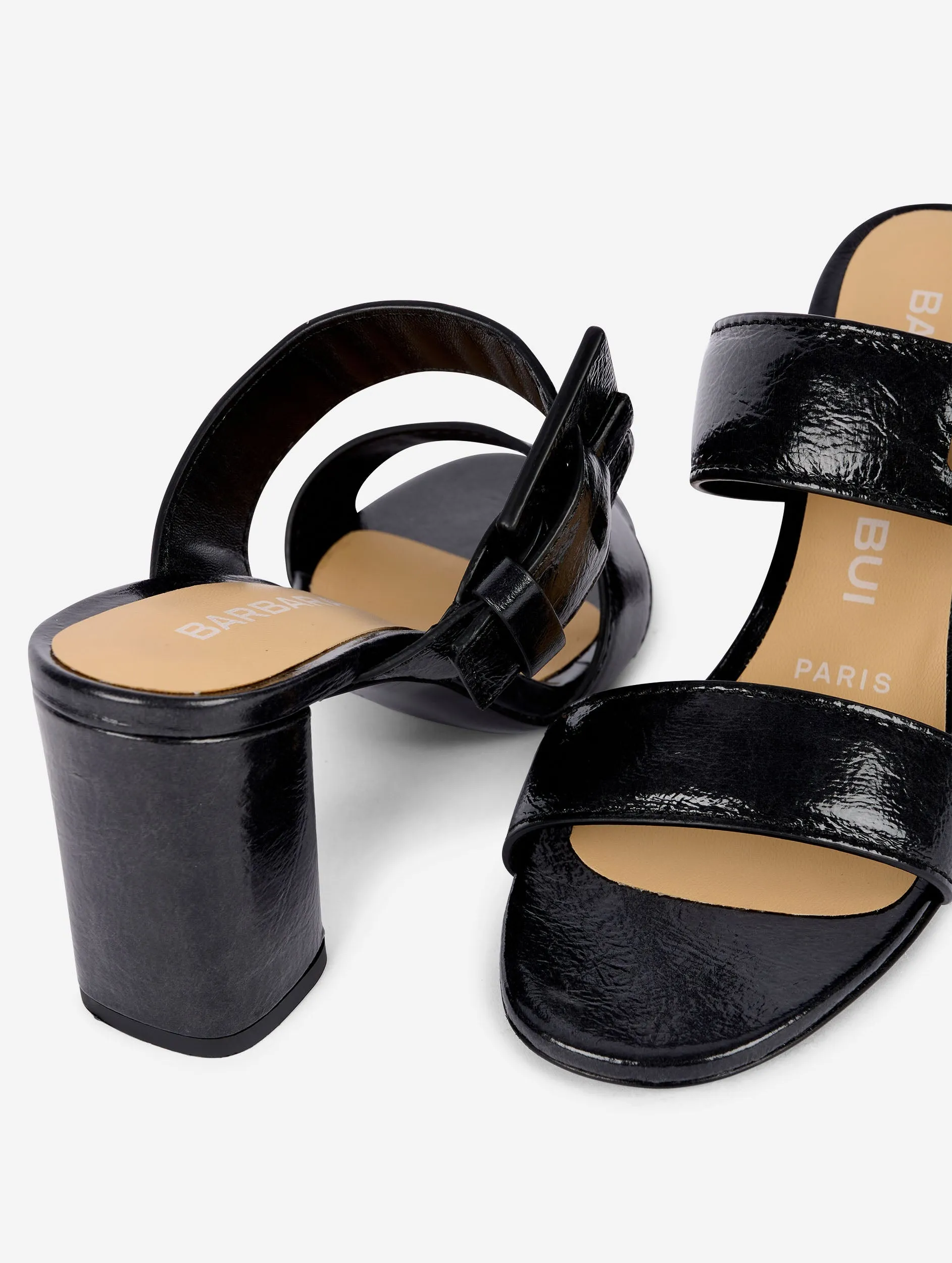 Mules in navy patent leather