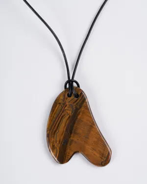 tigers eye plaque on leather - stone brown
